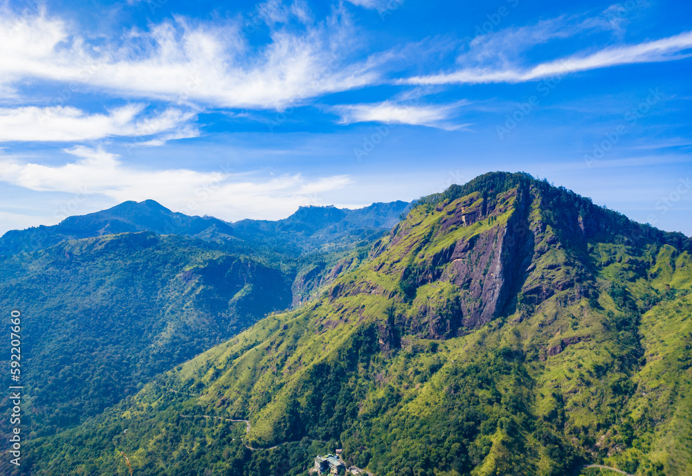 Obraz premium Beautiful mountain tropical landscape with green hills and blue sky. Photography for tourism background, design and advertising.
