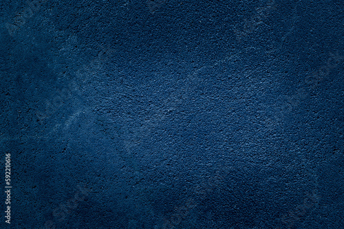 Dark blue Background. Concrete Texture wall painted blue. Space for design and text.