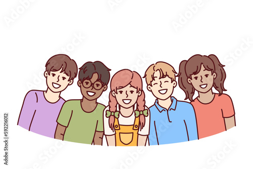 Happy diverse children students in junior school smiling rejoicing at opportunity to communicate with friends. Children teenagers of different races and nationalities laugh enjoying communication