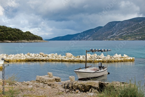 A small old fishing boat moored to the harbor on the island of Korcula in Croatia.
