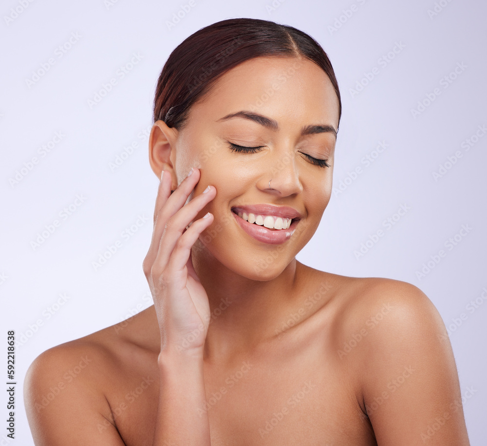 Woman, clean beauty and skincare in a studio with happiness and smile from dermatology. Skin glow, facial and cosmetics of a young female model feeling happy from self care and face wellness Woman, clean beauty and skincare in a studio with happiness and smile from dermatology. Skin glow, facial and cosmetics of a young female model feeling happy from self care and face wellness