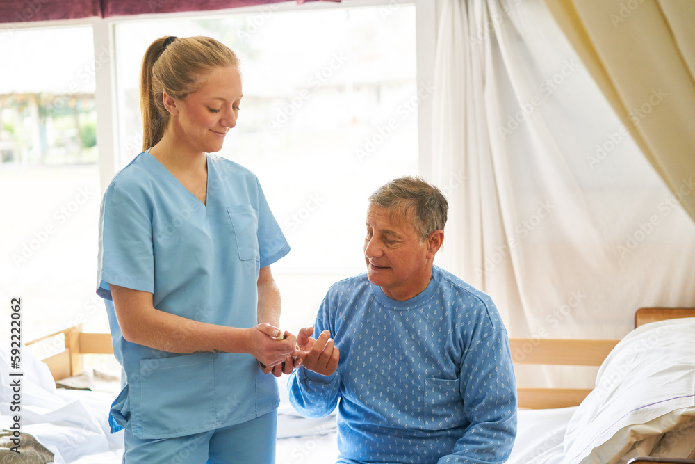 Nurse checking blood sugar of diabetic patient Nurse checking blood sugar of diabetic patient