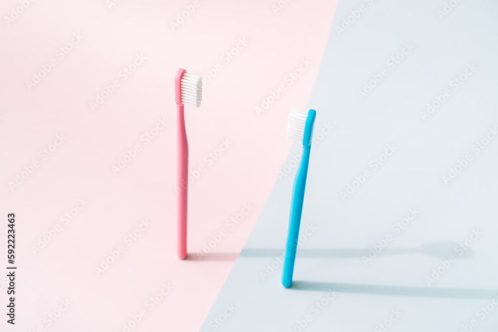 Toothbrushes on the background of gender colors. Toothbrushes on the background of gender colors.