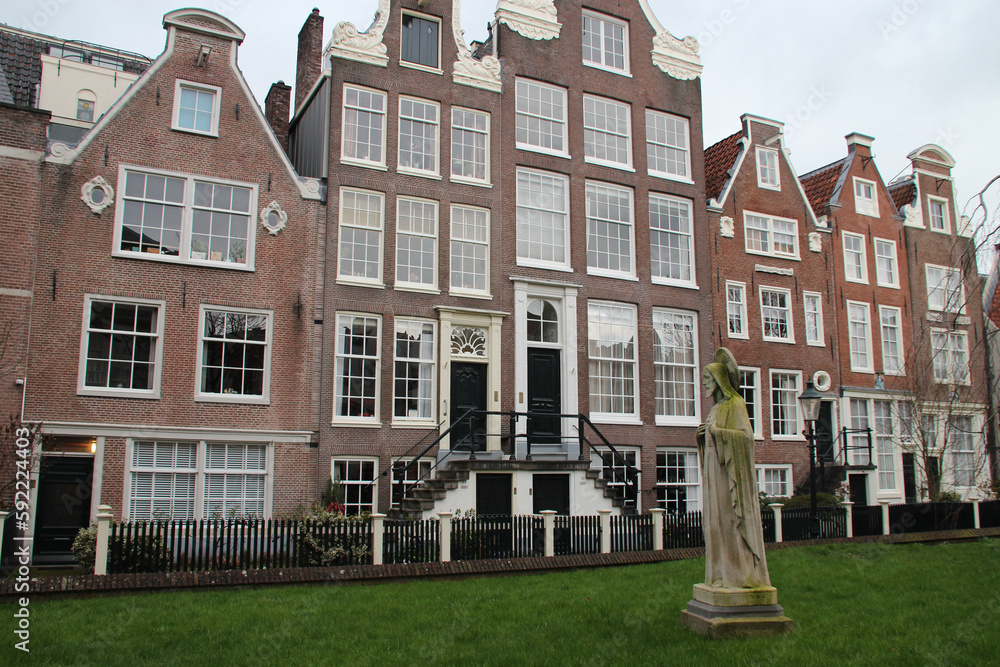 old brick houses at a beguinage (begijnhof) in amsterdam (the netherlands) 