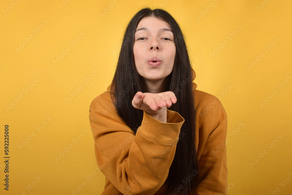 cute pretty brunette woman makes an air kiss cute pretty brunette woman makes an air kiss
