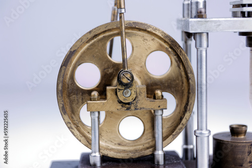 closeup of a stirling engine construction isolated on white