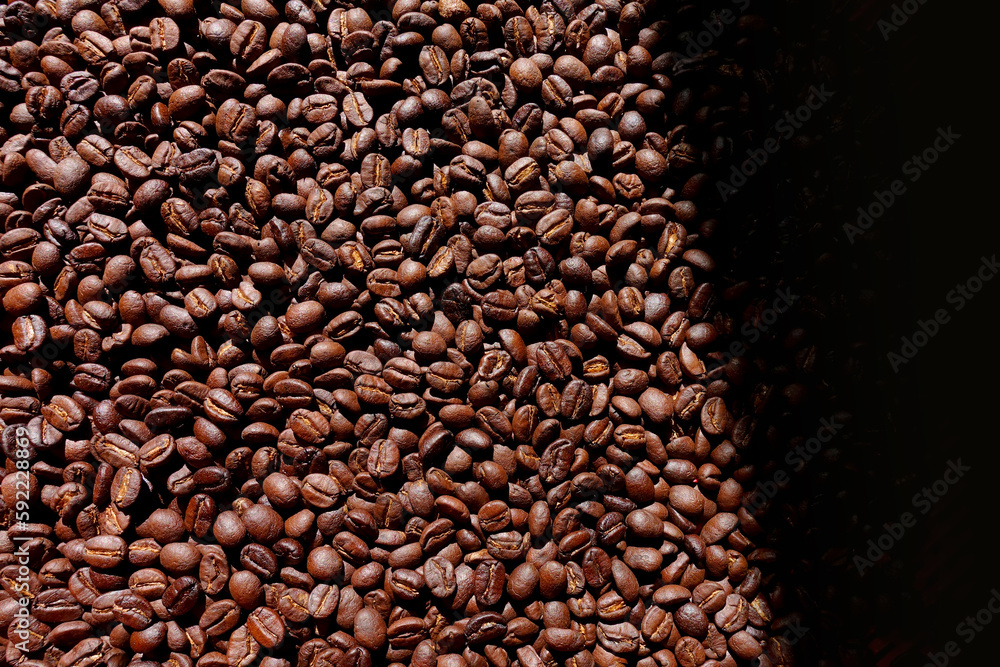 Roasted coffee beans background, Top view of brown coffee beans, Texture freshly roasted coffee beans. Roasted coffee beans background, Top view of brown coffee beans, Texture freshly roasted coffee beans.