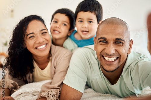 Happy family selfie  bedroom portrait and relax mother  father and children bonding  home and enjoy time together. Happiness  morning love or face of smiling mom  dad and kids on bed for memory photo