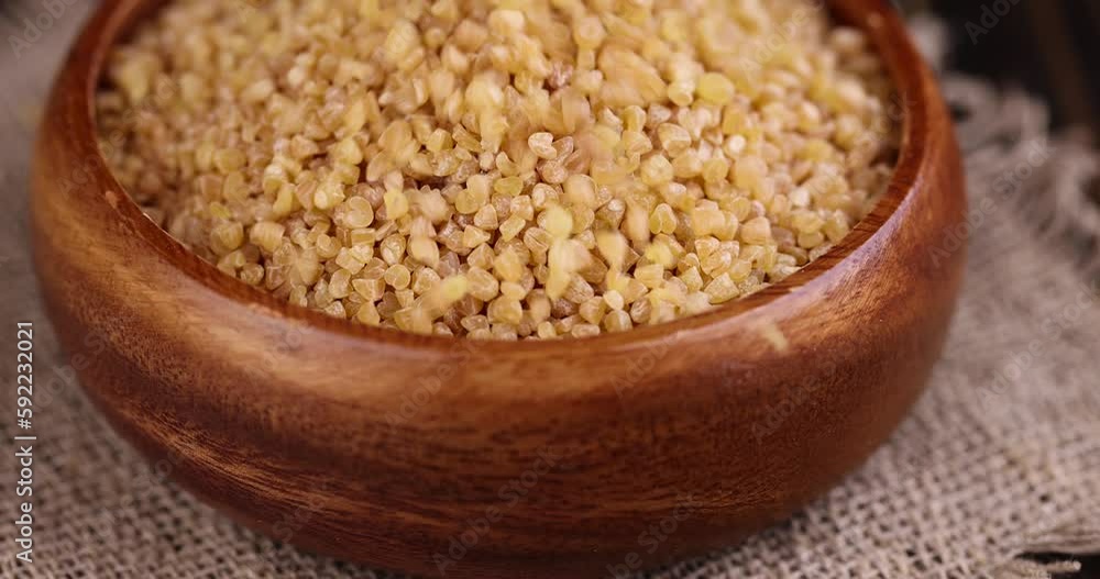 Pour and serve raw wheat porridge, crushed wheat grain for cooking porridge Pour and serve raw wheat porridge, crushed wheat grain for cooking porridge