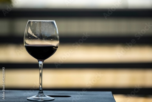 Glass with red wine on a balcony table