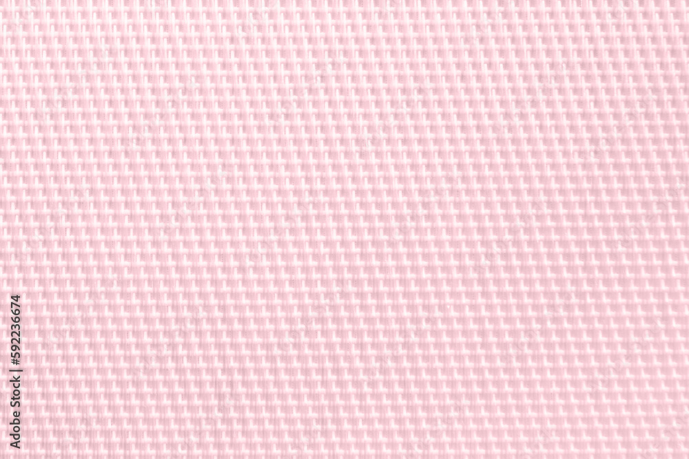 Light pink napkin weaving threads close up. Synthetic material, fabric structure, top view. Light pink napkin weaving threads close up. Synthetic material, fabric structure, top view.