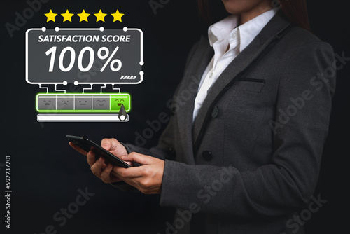Smart customer woman hands pressing on online application screen with excellent 100% rating for service evaluation on smartphone virtual touch screen. Customer satisfaction survey experience concept.