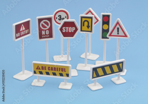Close up of traffic signs on blue background.