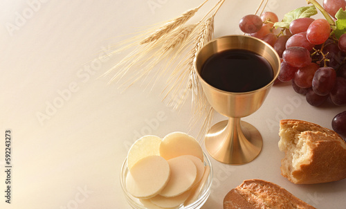 Cup of consecrated wine and hosts for the Eucharist
