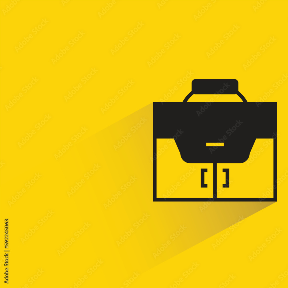 briefcase with shadow on yellow background briefcase with shadow on yellow background
