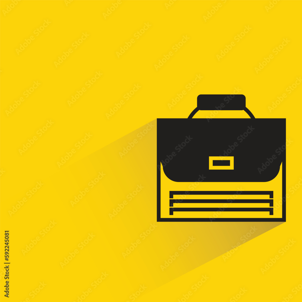 briefcase with shadow on yellow background briefcase with shadow on yellow background