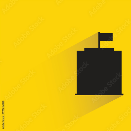 condo tower with shadow on yellow background