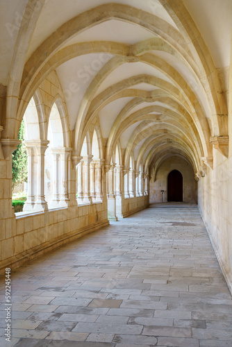 monestary corridors with arches and paved walkways © mikefoto58