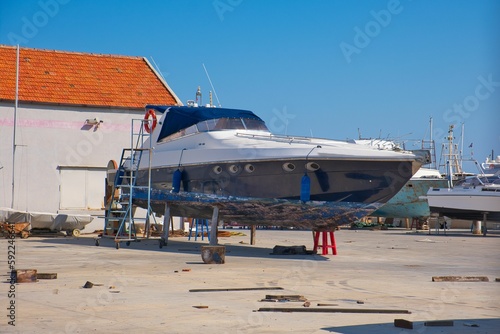 Boat in construction in Manfredonia, Italy with a clear blue sky above