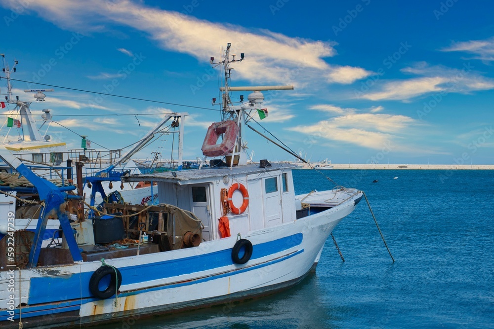 Closeup of fisher boat parked in harbor of Manfredonia