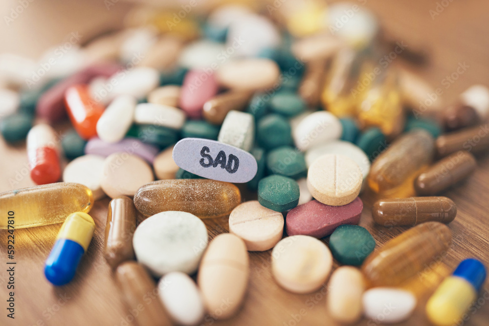 Healthcare, depression or table with medicine pills or supplements products at drugstore clinic. Pharmaceuticals background, blur or medical vitamins, stress anxiety tablets or sad medication closeup Healthcare, depression or table with medicine pills or supplements products at drugstore clinic. Pharmaceuticals background, blur or medical vitamins, stress anxiety tablets or sad medication closeup