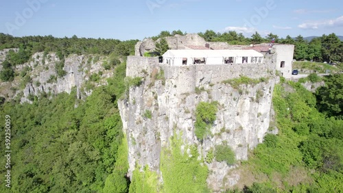 Aerial view of the historic San Servolo Castle and nearby hills in Crni Kal, Slovenia photo