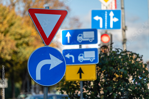 Cars moving on the road in city in autumn. View to the traffic with signs, trafficlights and cars photo