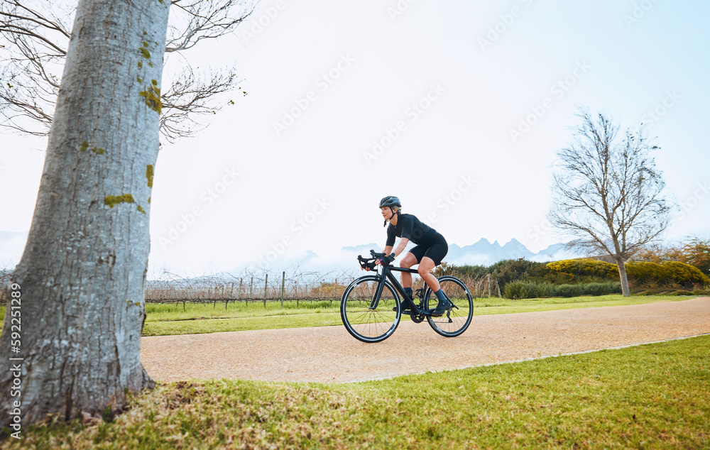 Cycling, fitness and sports with woman in park for training, workout and health mockup. Exercise, travel and freedom with female cyclist riding on bike in nature for adventure, journey and transport