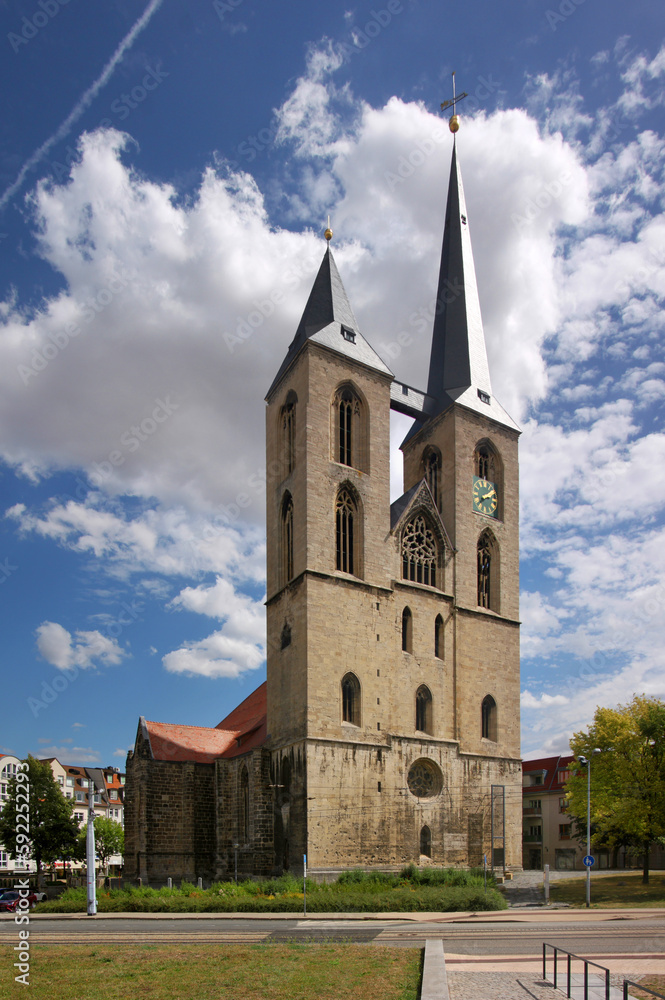 Gothic St. Martini church with bell towers in the old town of Halberstadt, Sachsen-Anhalt in Germany