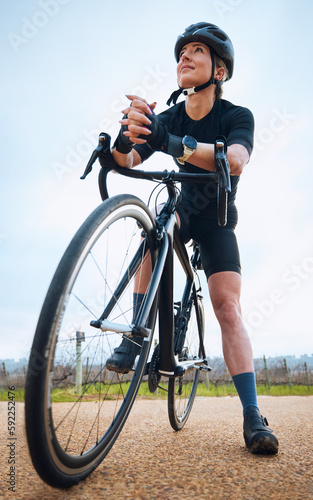 Thinking, cycling and fitness with woman in nature for training, workout or sports cardio. Health, relax and strong with female cyclist riding on bike in outdoor for exercise, endurance and challenge
