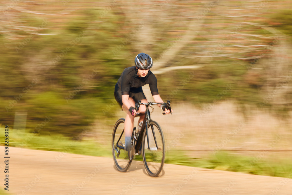 Bicycle, sports and woman cycling in a forest for fitness, exercise and morning cardio in nature. Training, bike and female workout in a park, freedom and energy, performance and intense endurance Bicycle, sports and woman cycling in a forest for fitness, exercise and morning cardio in nature. Training, bike and female workout in a park, freedom and energy, performance and intense endurance