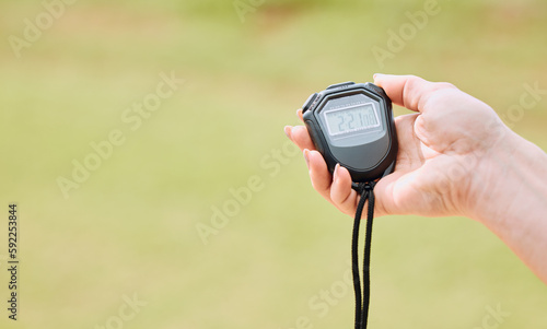 Hand, stopwatch and mockup with a personal trainer outdoor for sports, fitness or training for a time trial. Exercise, watch and workout with a coach timing an athlete outside for cardio or endurance