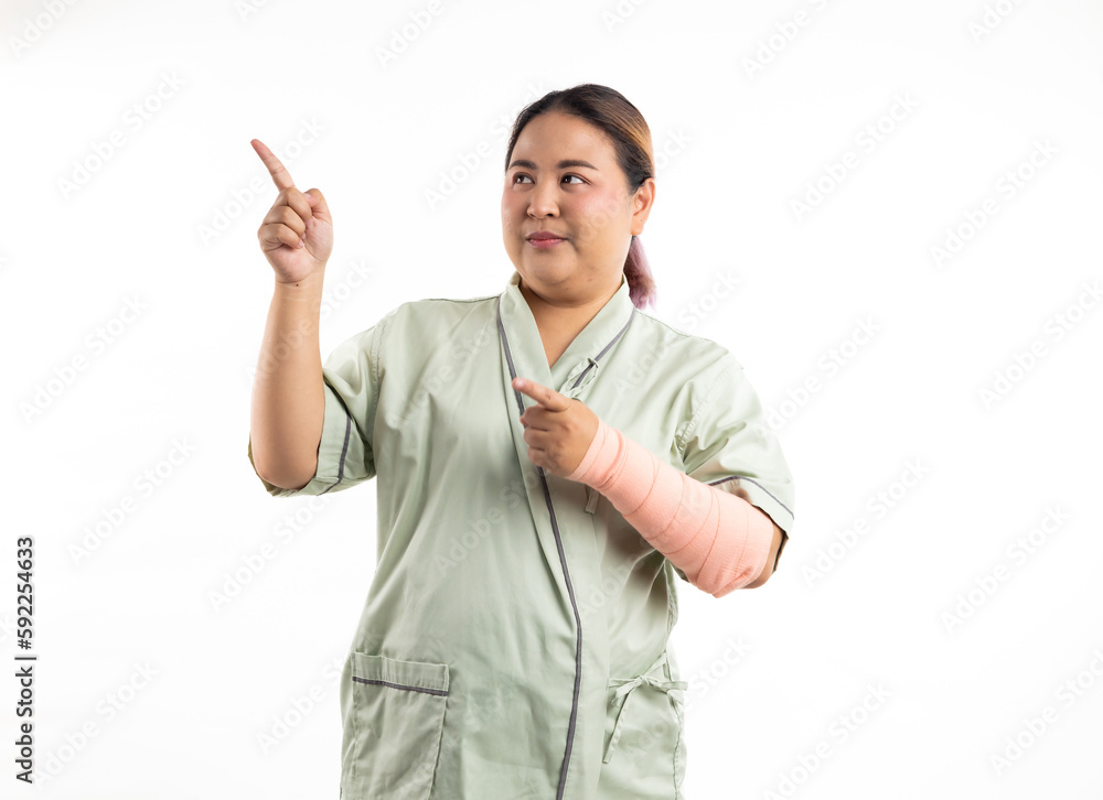 Excite female patient pointing up and looking at camera. Happy winner smiling asian women patient on white background. Fat and overweight obese woman Excite female patient pointing up and looking at camera. Happy winner smiling asian women patient on white background. Fat and overweight obese woman