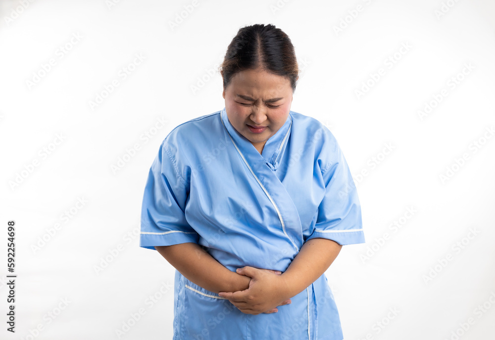 Female having stomach ache, bending and holding hands on belly. Stomach ache asian women patient on white background. Fat and overweight obese woman Female having stomach ache, bending and holding hands on belly. Stomach ache asian women patient on white background. Fat and overweight obese woman