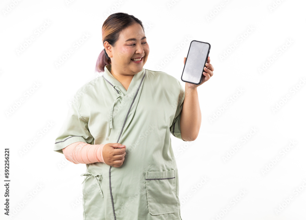 Female patient show and point mobile phone. Happy smiling asian women patient on white background. Fat and overweight obese woman. online doctor Female patient show and point mobile phone. Happy smiling asian women patient on white background. Fat and overweight obese woman. online doctor
