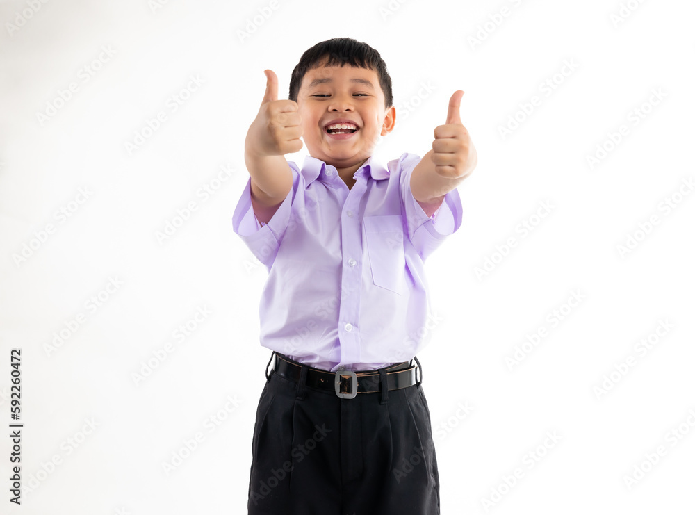Excited happy smilling boy thumb up. Thai school uniform with backpack bag. Portrait Young Asian cute boy standing on white background banner. Back to school. Excited happy smilling boy thumb up. Thai school uniform with backpack bag. Portrait Young Asian cute boy standing on white background banner. Back to school.