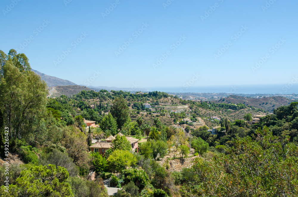 Beautiful landscape with green hills near Marbella city. Andalusia, Province of Malaga, Costa del Sol, Spain.