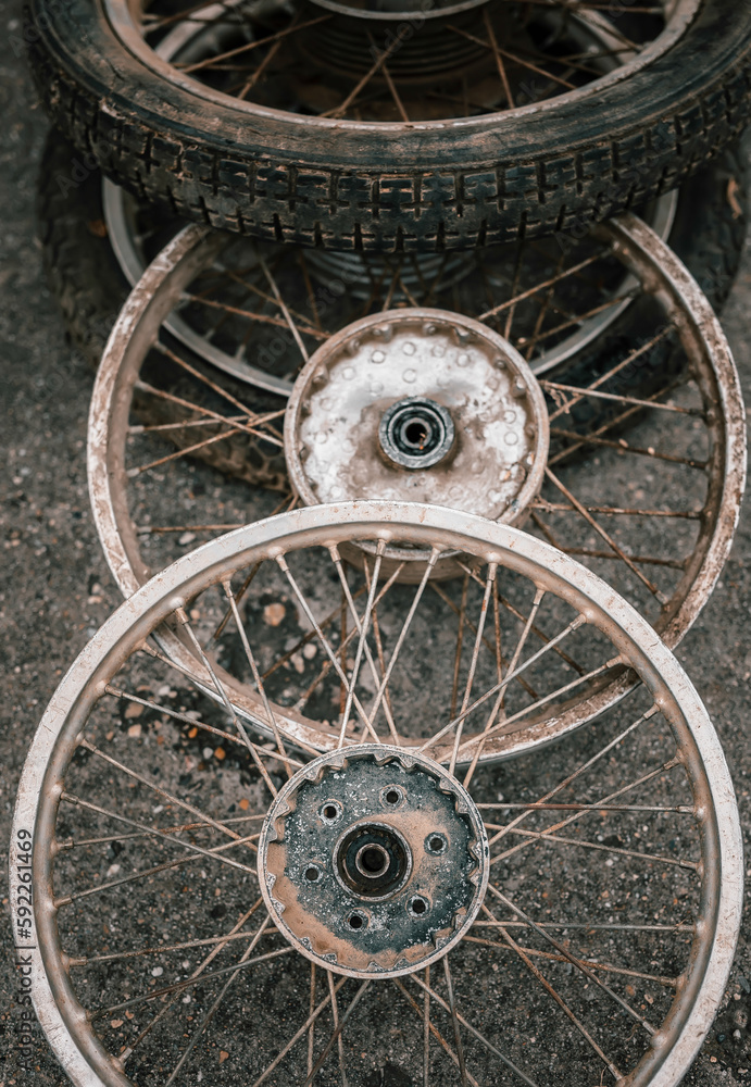 Heap of wheels of old motorbike