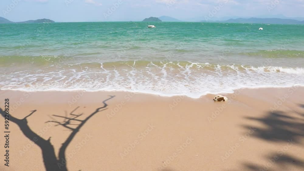 View of the clear blue sea with beautiful waves on a sunny summer day. A tropical landscape with azure water and sandy bottom. View of the clear blue sea with beautiful waves on a sunny summer day. A tropical landscape with azure water and sandy bottom.