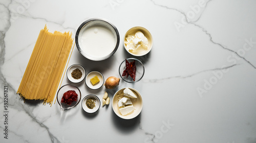 Mexican pasta ingredients. Pasta with sauce based on sour cream and heavy cream  butter and stock. Spicy with chili  onions  and garlic