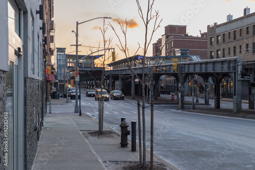 Cold morning on street in Brooklyn with Long Island Railroad train station passing through background photo