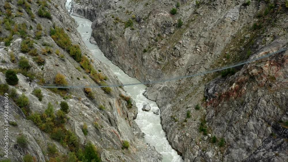 Suspension bridge Aspi aerial view in the Swiss alps Suspension bridge Aspi aerial view in the Swiss alps