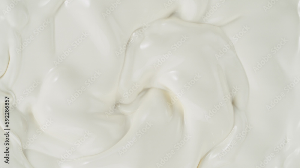 Freeze motion of whirling milk cream, close-up Freeze motion of whirling milk cream, close-up