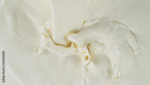 Freeze motion of whirling milk cream  close-up
