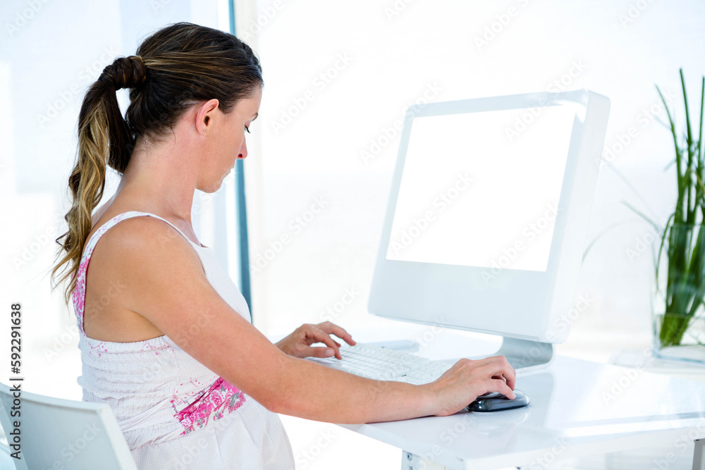 Pregnant woman using laptop