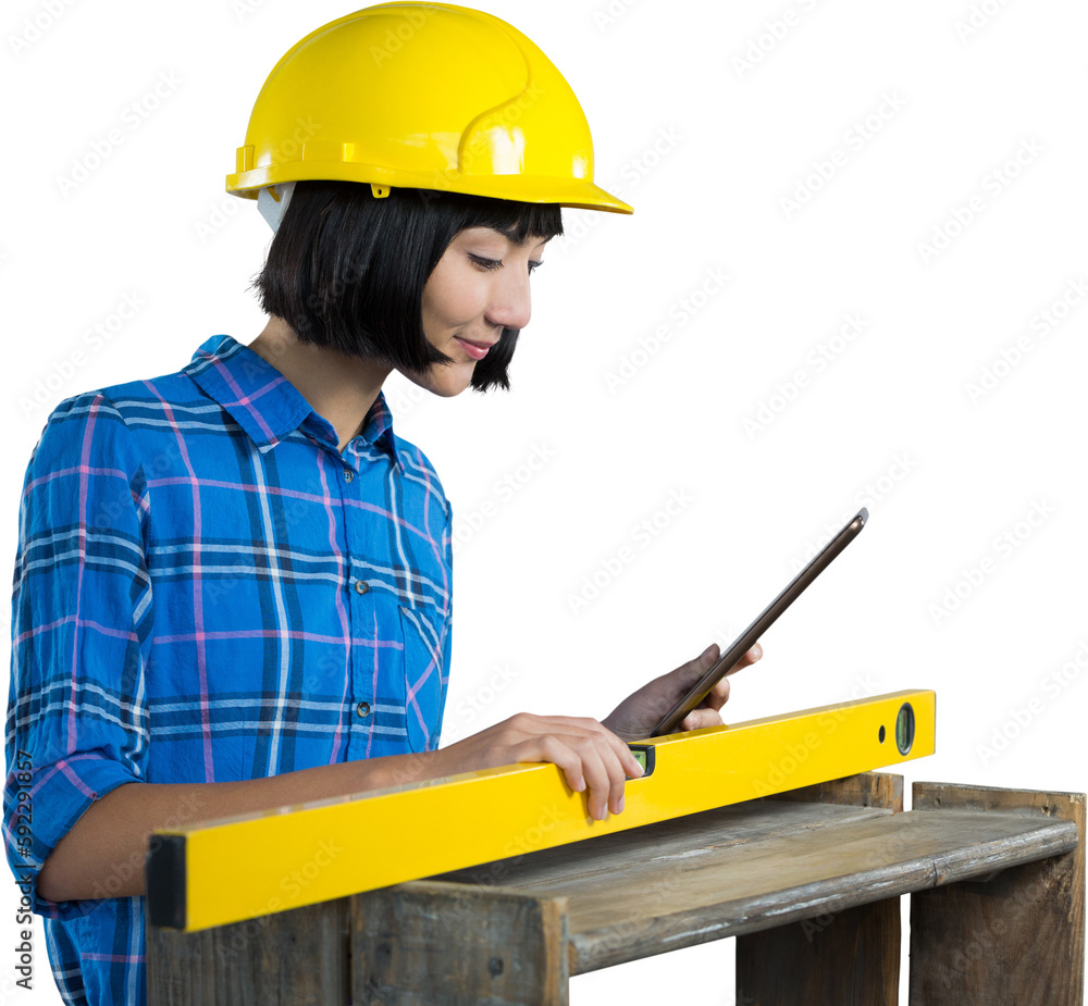 Female architect measuring plywood with engineer scale