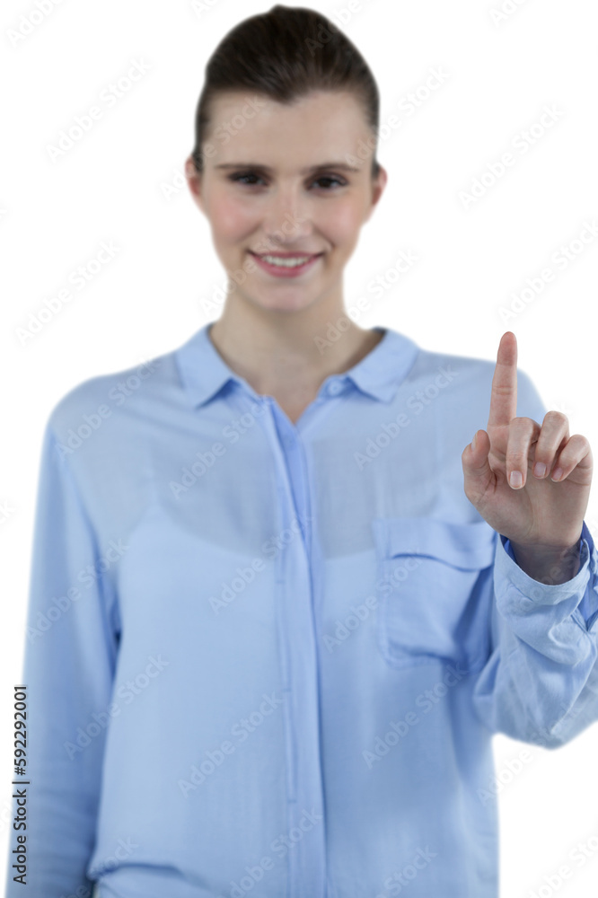 Smiling businesswoman using imaginative digital screen Smiling businesswoman using imaginative digital screen