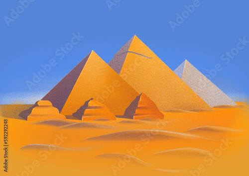 Pyramid complex of Giza in the sesert sands ander the blue sky