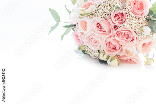 Fototapeta Naklejka Na Ścianę i Meble -  Beautiful bouquet of pink roses and ranunculus. stylish wedding attributes of bride. blooming flowers festive background, pastel and soft bouquet floral card