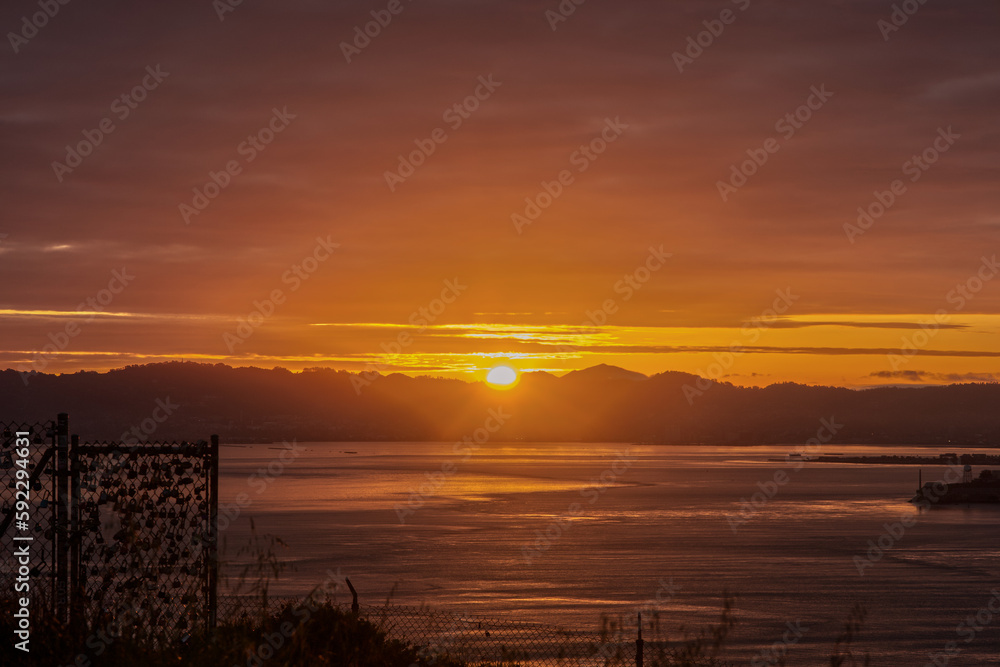 Sun Rising Behind East San Francisco Bay Area Mountains During Sunrise from Marin Headlands
